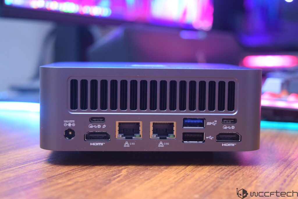 A mini PC rear view showing multiple ports including two 'HDMI' ports, two USB-C ports labeled '40 Gbps,' two 2.5G Ethernet p