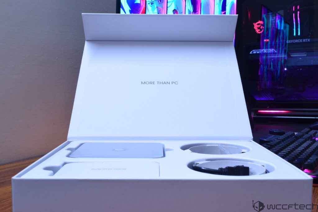 An open packaging box with the text 'More Than PC' is placed in front of an illuminated desktop PC displaying MSI and GeForce
